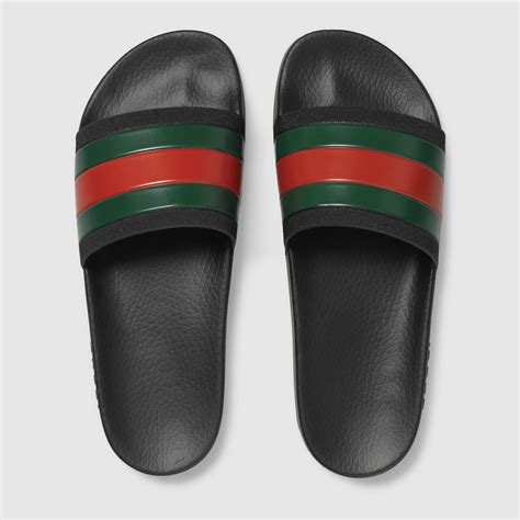 black gucci rubber slides.